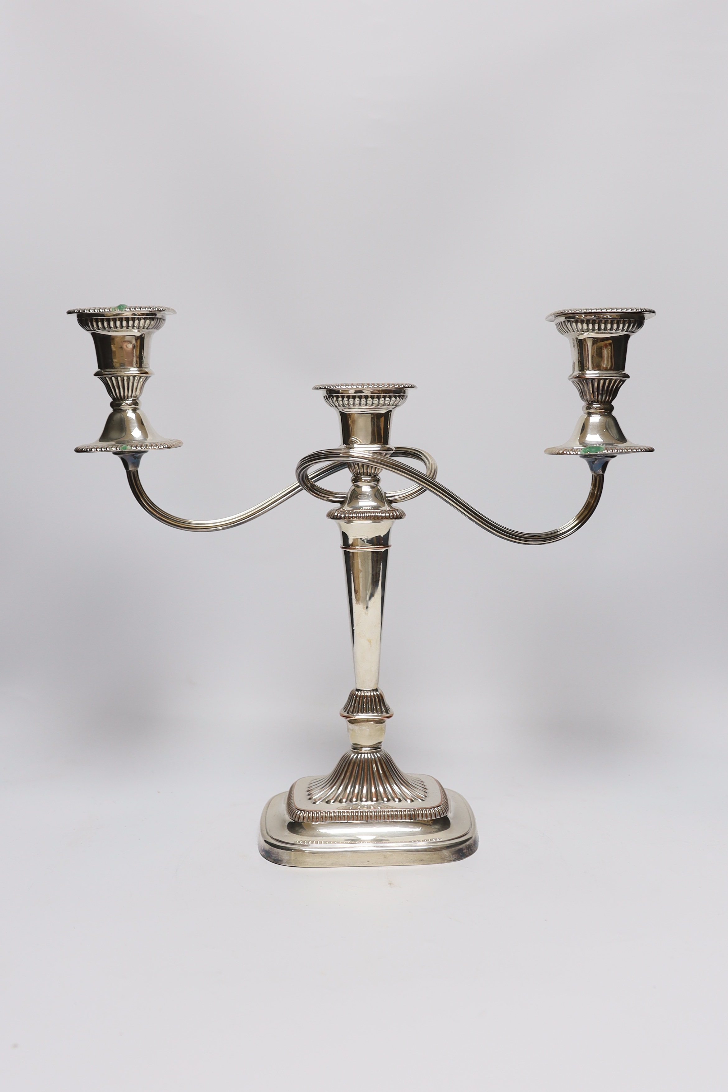 A pair of silver plated on copper twin branch three light candelabra, a 